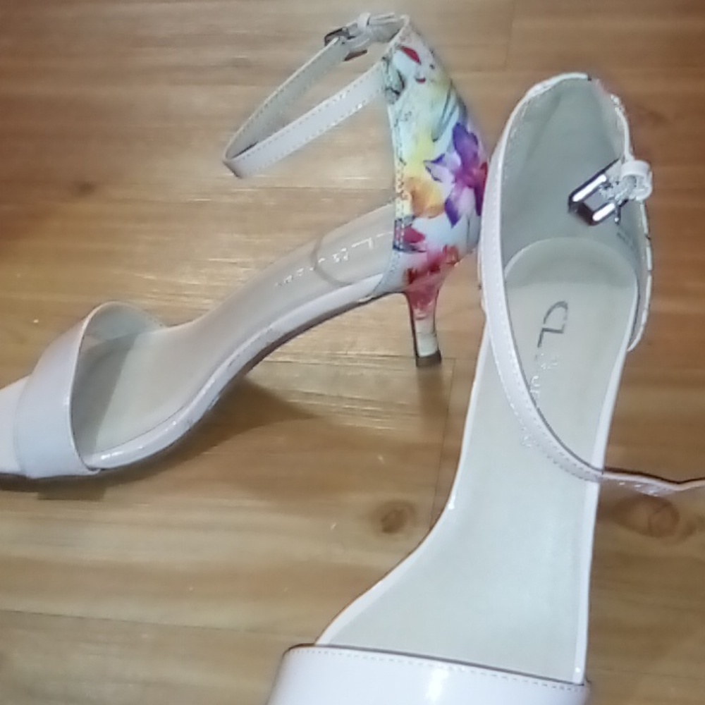 Women's nude colored patent leather pumps